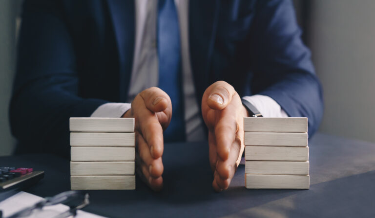 man separates wooden block. Property division. Divorce